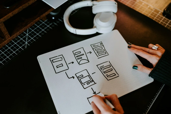 a person is writing on a piece of paper